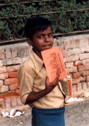 Boy selling postcards, Agra